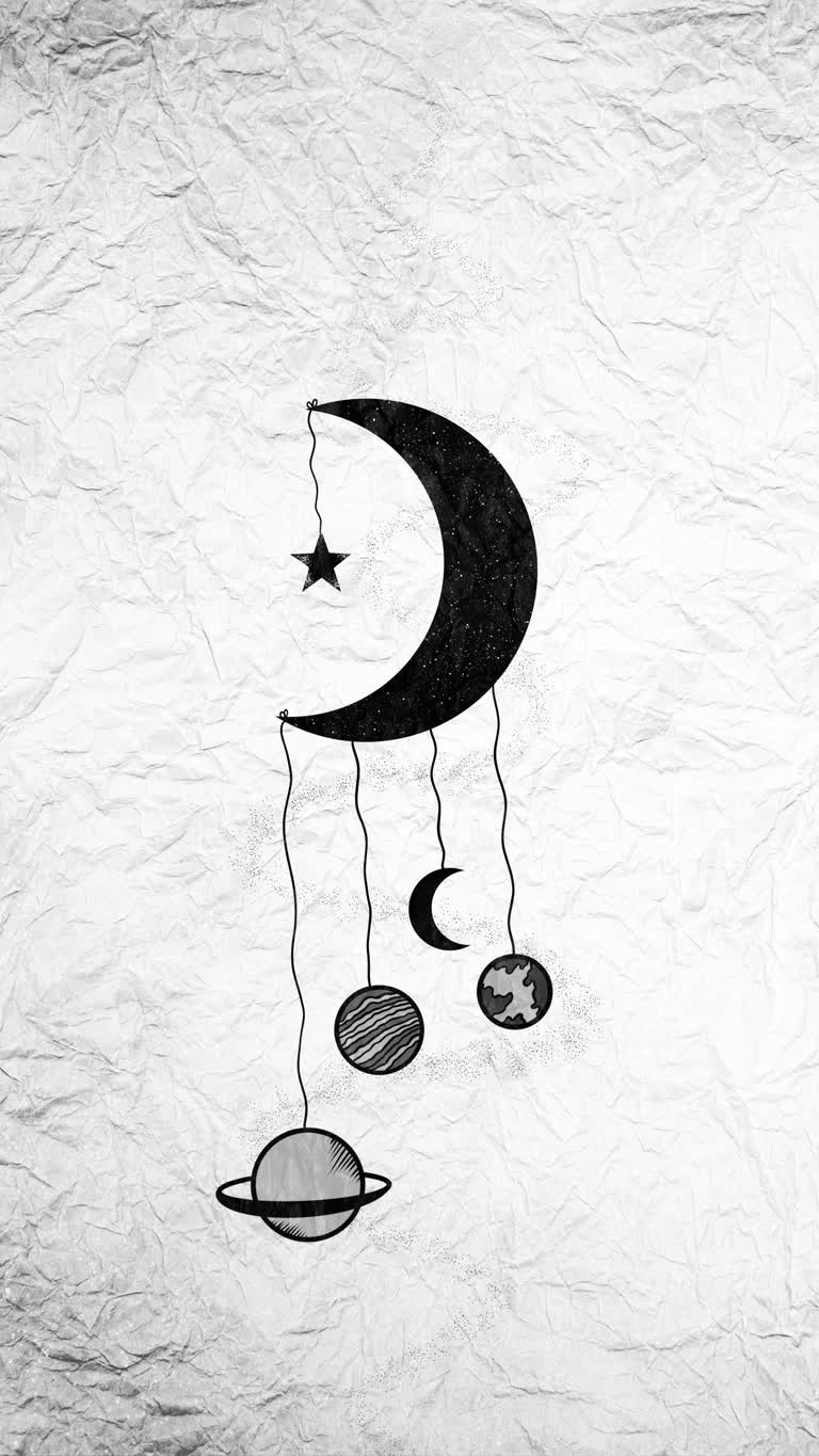 有一幅月亮和行星的图画挂在绳子上