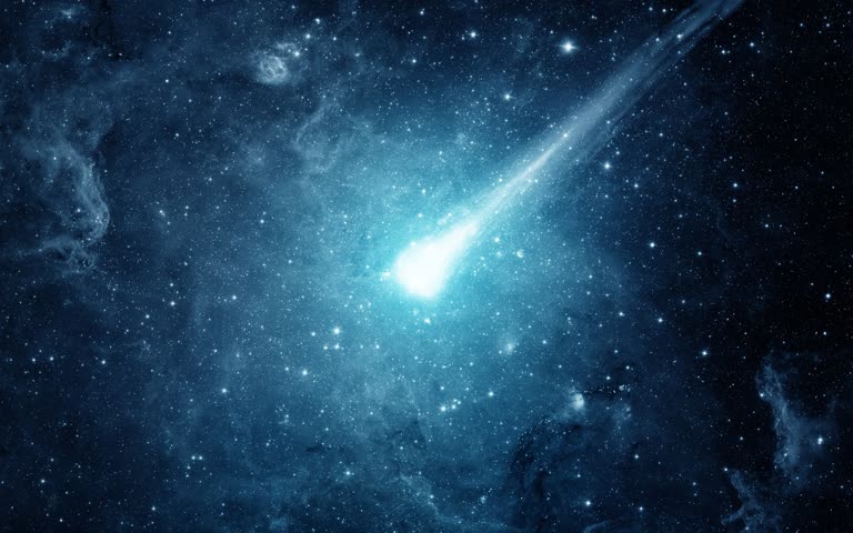 这是夜空中一颗亮蓝色彗星的图像