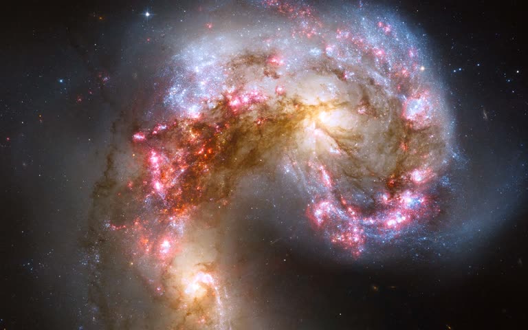 这是太空中一对螺旋星系的图像