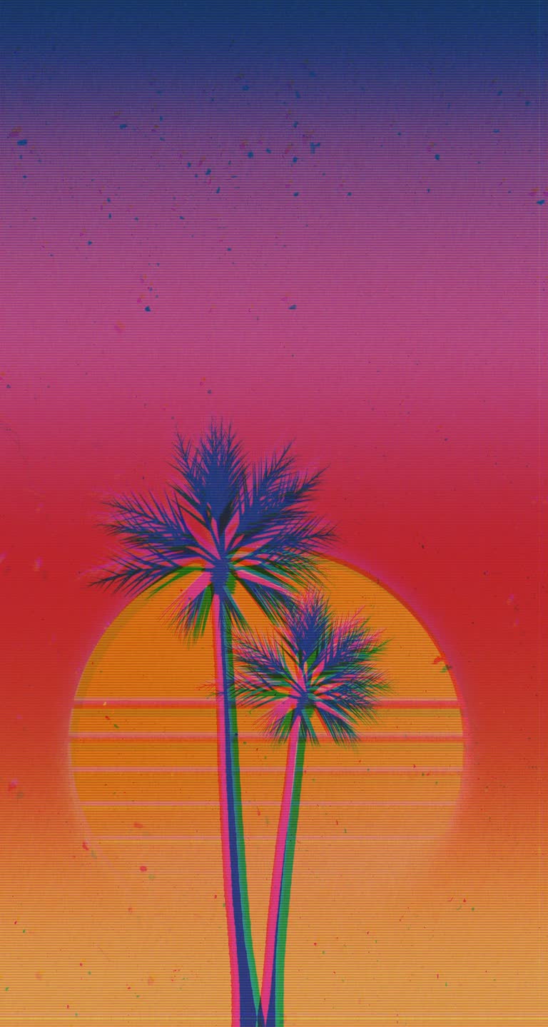 夕阳前矗立着两棵棕榈树
