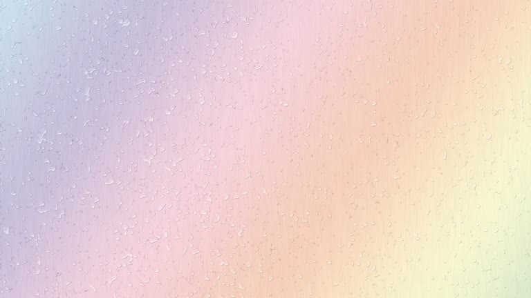 这是一张带有水滴的彩虹色背景的图片
