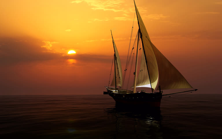 有一艘帆船,在夕阳时分在海洋中航行