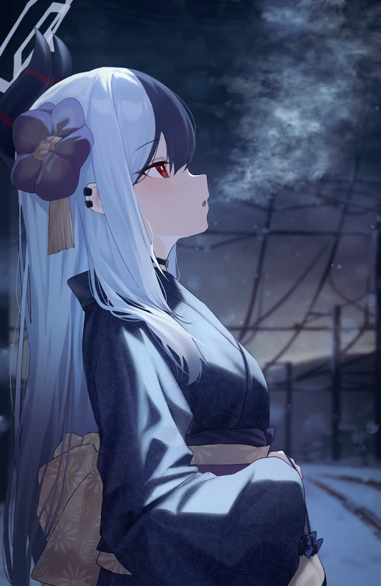 有一个女人坐在雪地里的长椅上